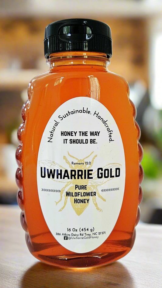 Bottle of Uwharrie Gold honey on a white background
